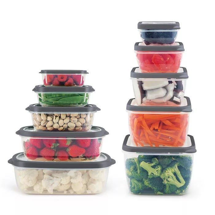 The Art & Cook 20pc Plastic Food Storage Set includes a variety of clear containers with grey lids, featuring neatly stacked sizes filled with fruits, vegetables, and nuts, designed for convenient storage and organization.