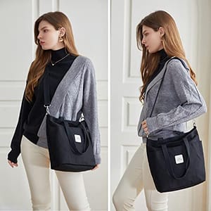 A black canvas tote bag with a white label is showcased on a person's shoulder in two poses, one highlighting the front and the other the side profile.