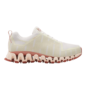 White athletic shoe with a unique, wavy sole design in shades of pink and peach, featuring a branded logo on the tongue and heel loop for easy wear.