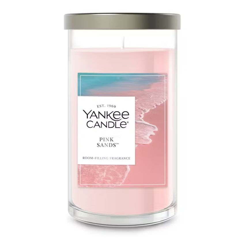 Yankee Candle Pink Sands, a room-filling fragrance candle in a glass jar with a lid, featuring a pink wax and a coastal-themed label.