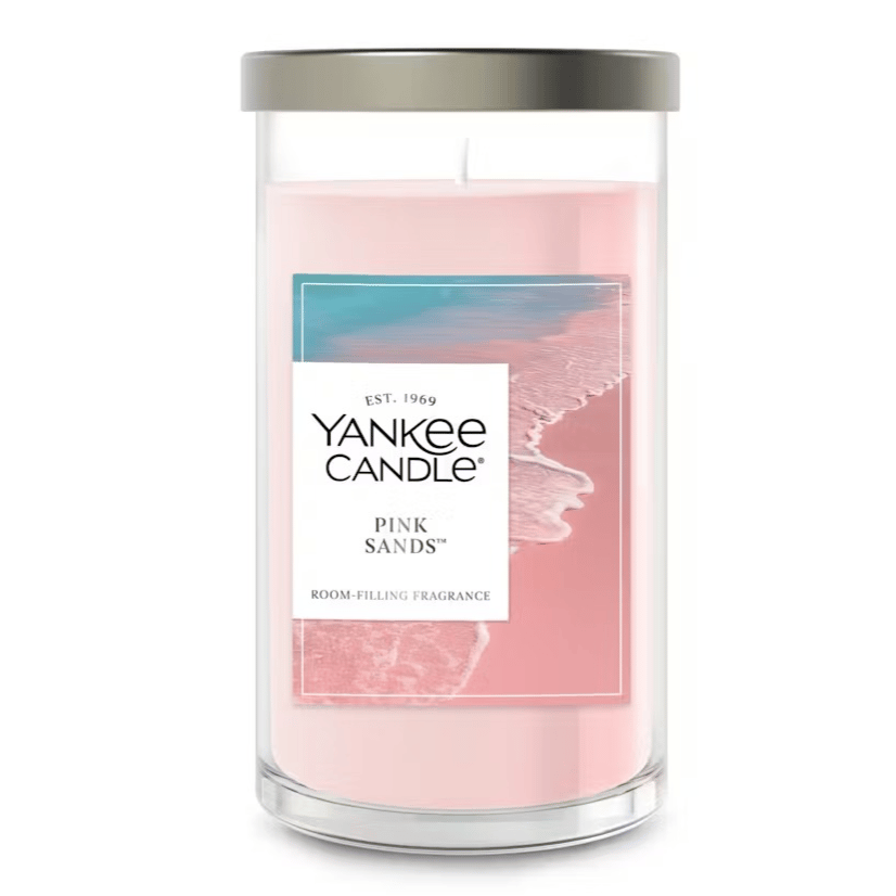 Yankee Candle Pink Sands, a room-filling fragrance candle in a glass jar with a lid, featuring a pink wax and a coastal-themed label.