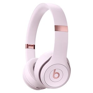 Pink over-ear wireless headphones with rose gold accents, featuring the Beats logo on the ear cups.