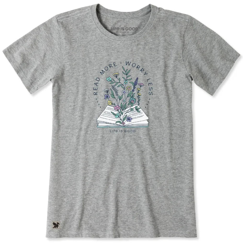 Gray T-shirt with a design of an open book with flowers and the text \“READ MORE, WORRY LESS\“ and \“LIFE IS GOOD.\“
