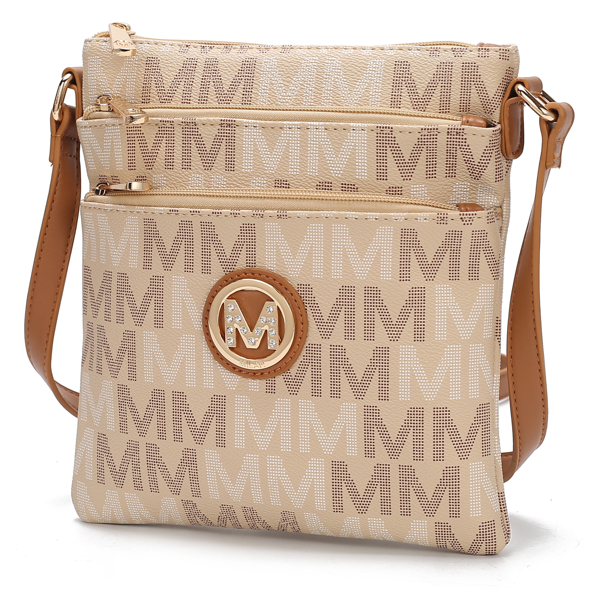 A beige crossbody bag with a brown adjustable strap, featuring a repeating \“M\“ pattern and a decorative \“M\“ emblem with rhinestones.