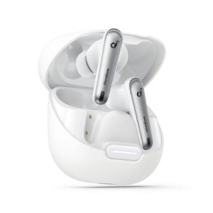 White wireless earbuds with silver stems in an open charging case, labeled \“soundcore.\“