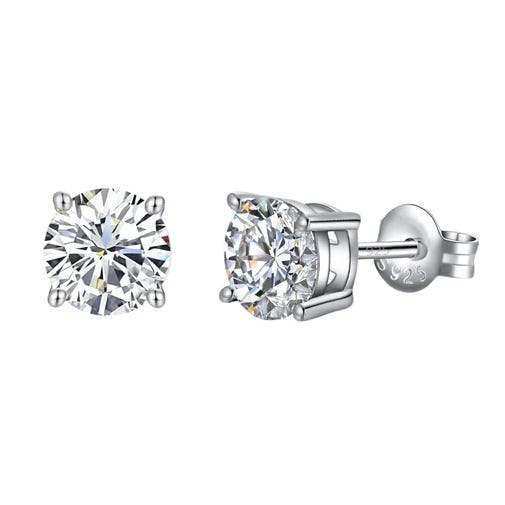 A pair of round-cut, silver-tone stud earrings with clear stones, featuring a four-prong setting and a 925 sterling silver mark on the backing.