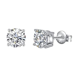 A pair of round-cut, silver-tone stud earrings with clear stones, featuring a four-prong setting and a 925 sterling silver mark on the backing.
