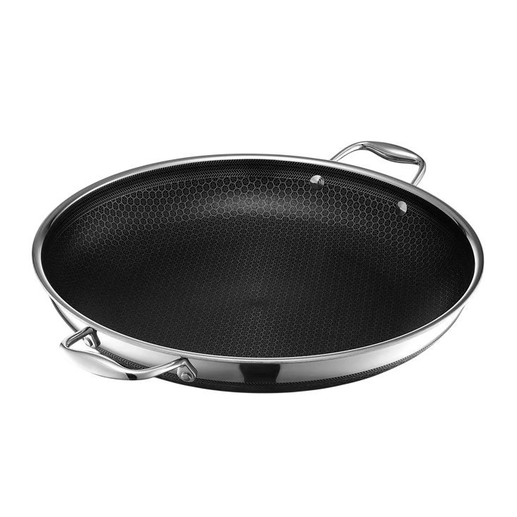 A nonstick frying pan with a stainless steel finish and honeycomb texture, featuring two sturdy handles.