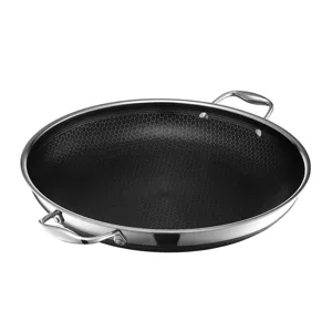 A nonstick frying pan with a stainless steel finish and honeycomb texture, featuring two sturdy handles.