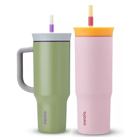 Two Owala water bottles are shown; one is a pastel green with a mug handle and purple-accented flip lid, and the other is pastel pink with a yellow-accented flip lid and straw.
