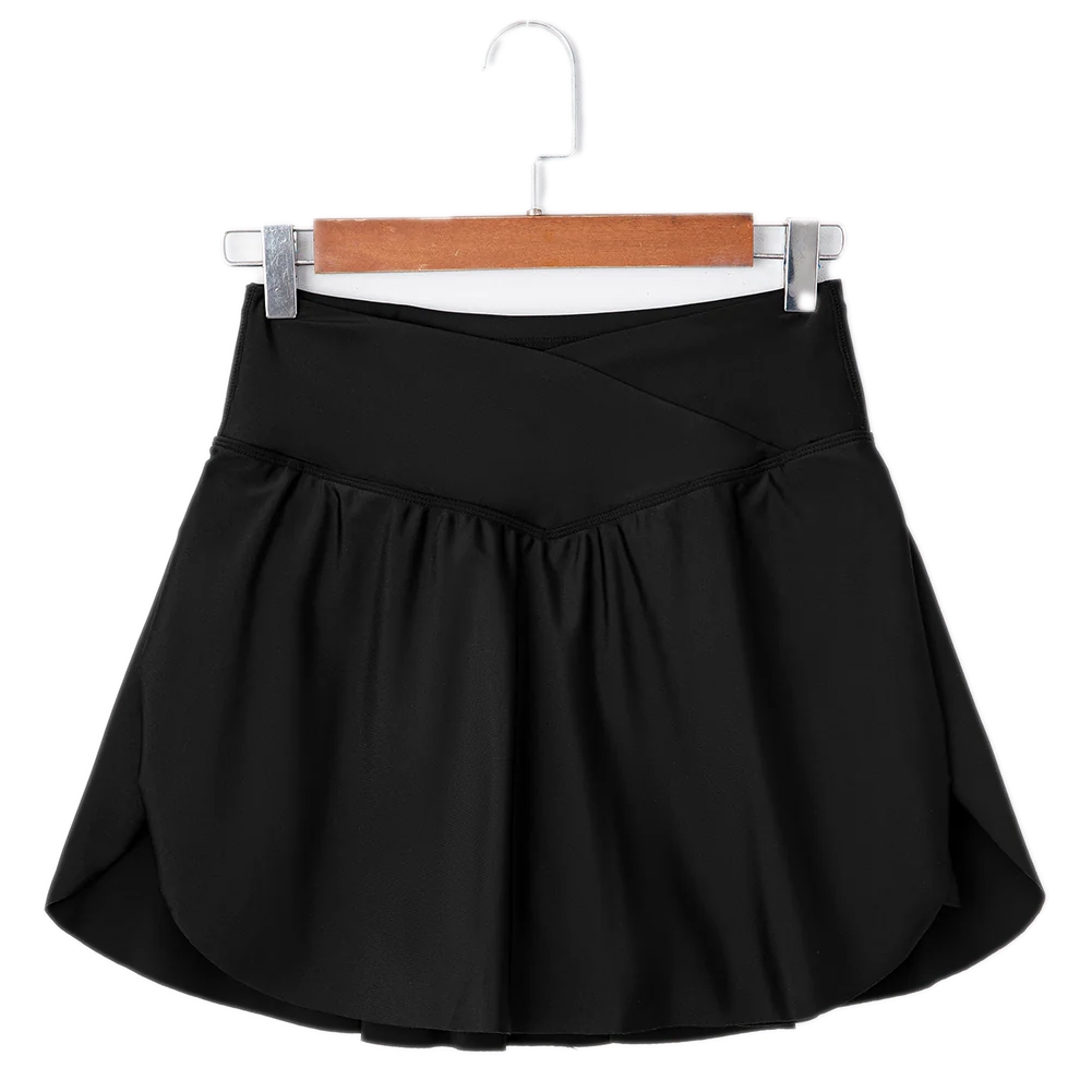 A black high-waisted swim skort with a crossover waistband and slightly pleated skirt. It's designed for a comfortable fit and versatile swimwear style.