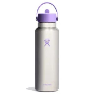 A silver Hydro Flask 40oz bottle with a purple logo, lid, and handle. It features a sturdy, sleek design, suitable for carrying beverages and maintaining temperature.