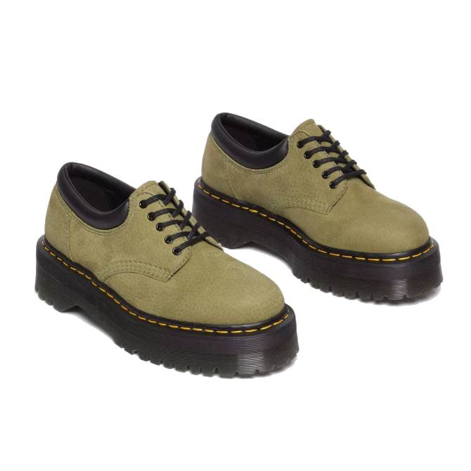 Olive green nubuck leather shoes with black soles featuring yellow stitching around the base. They have a lace-up design with black laces.