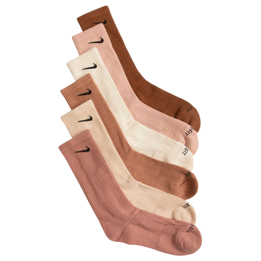 A set of five pairs of socks in various shades of brown and beige, each featuring a small black swoosh logo near the top.