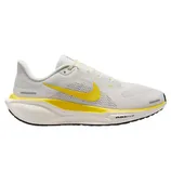 A white and yellow Nike Air Zoom running shoe with mesh upper and cushioned sole, designed for comfort and performance.