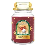 Yankee Candle x The Polar Express \“First Gift of Christmas,\“ scented with brown sugar and sandalwood, in a decorative jar with festive imagery and a bell motif.