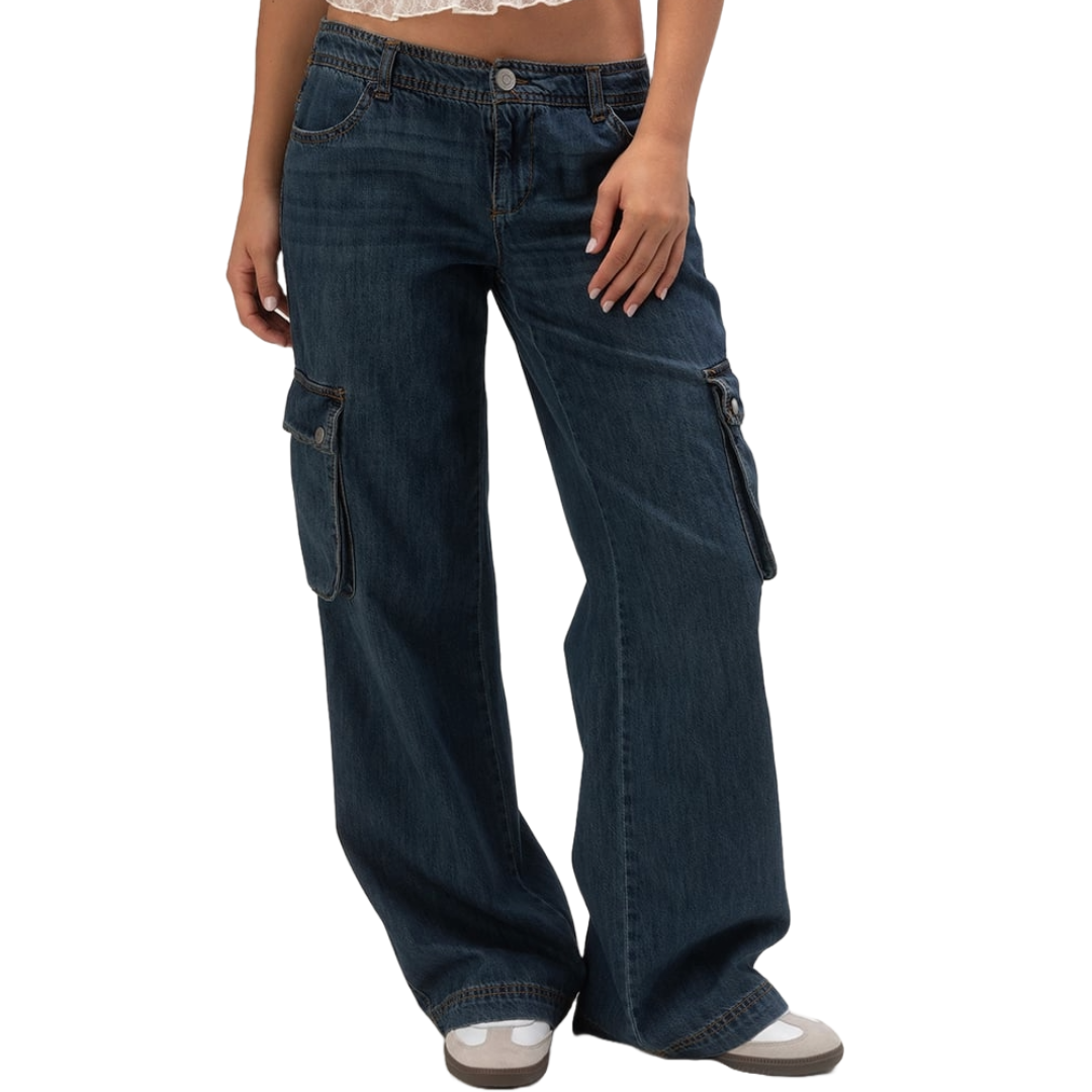 Dark wash, wide-leg denim cargo pants with side flap pockets, paired with a lace-trimmed top and casual sneakers.