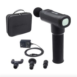 AmazonBasics massage gun with multiple head attachments, a charger, and a carrying case.