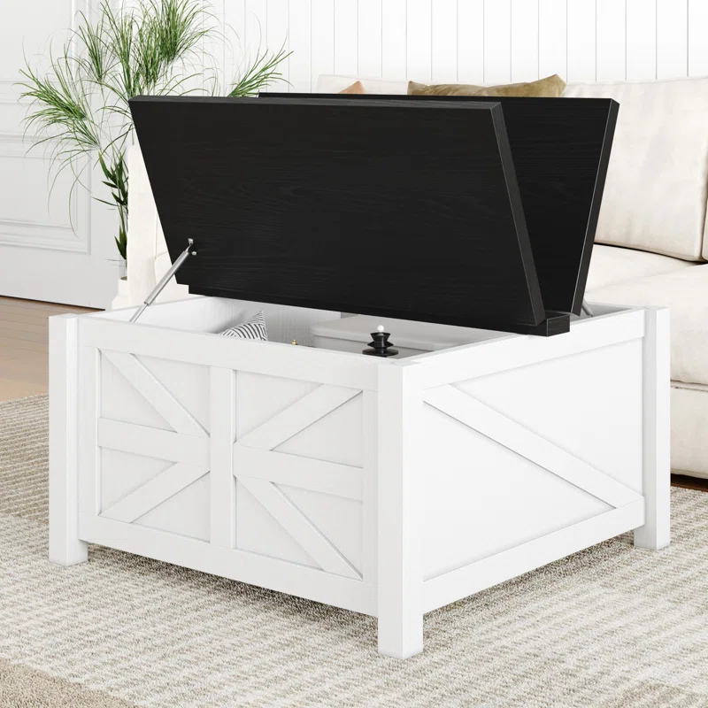 White wooden lift-top coffee table with a black top and geometric panel design, featuring interior storage.
