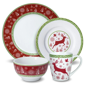 Festive dinnerware set featuring red and green patterns with reindeer, snowflakes, and trees, including a plate, bowl, and mug.