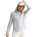 A person wearing a gray hoodie with a front pocket and a drawstring hood, paired with a light-colored cap and pants.