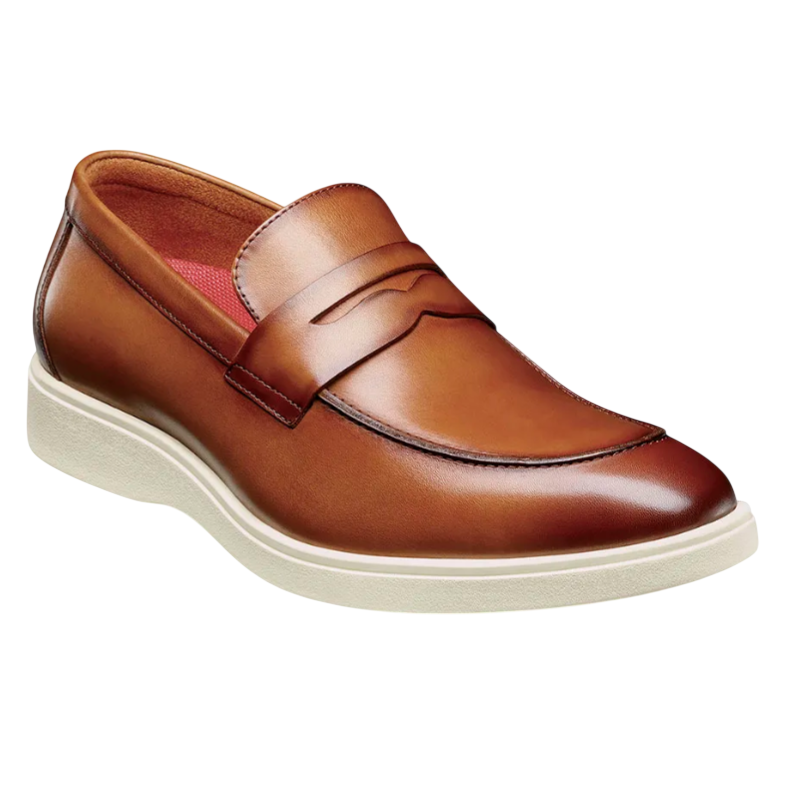 A brown leather penny loafer with a white sole and a red inner lining.