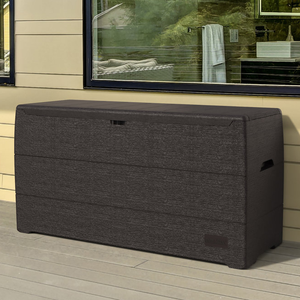 A large, dark woven outdoor storage box with a flat lid and side handles.
