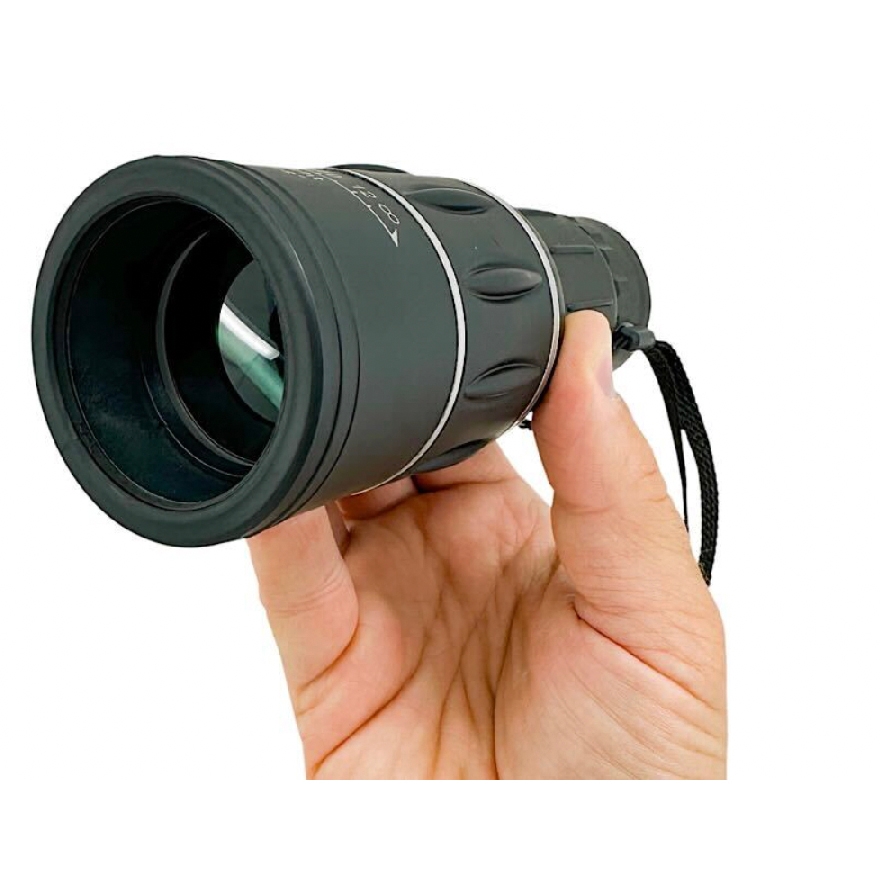 A black waterproof monocular with a textured grip and wrist strap, suitable for outdoor use and providing magnified viewing through a single lens.