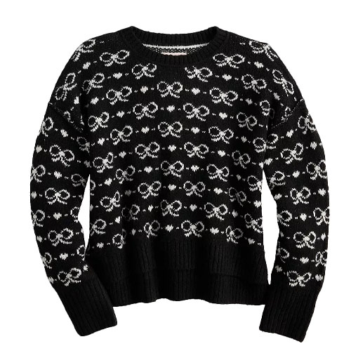 Black and white knit sweater featuring a pattern of interconnected loops and circles.