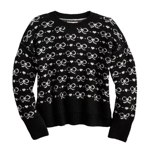 Black and white knit sweater featuring a pattern of interconnected loops and circles.