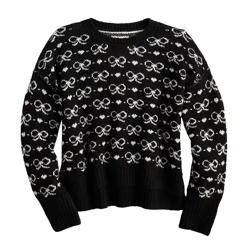 Black and white knit sweater featuring a pattern of interconnected loops and circles.