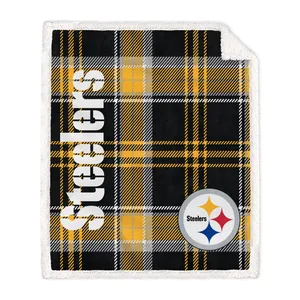 A plaid blanket featuring black, yellow, and white colors with the word \“Steelers\“ and the team's logo in one corner.