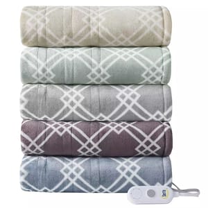 Five Serta Sherpa Heated Throws are stacked, each featuring a geometric pattern in different colors, accompanied by a white control device with a power button.