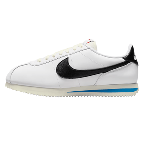 White sneaker with a black Nike swoosh and a hint of blue on the midsole, featuring a classic Cortez design with a textured rubber outsole.