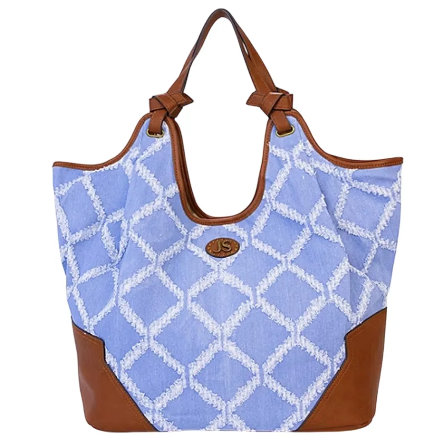 A blue and tan tote bag with a white diamond pattern, leather accents, and leather handles.