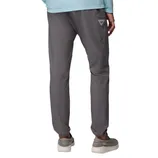 Gray pants with a relaxed fit, featuring a side pocket with a small triangular logo. Paired with gray slip-on shoes and a light blue top.