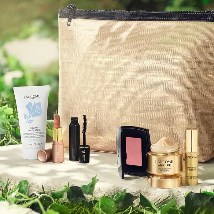Lancome Free 7pc Gift Set includes Crème Radiance face wash, lipstick, mascara, blush compact, Absolue soft cream, Absolue eye serum, and a gold-colored pouch.