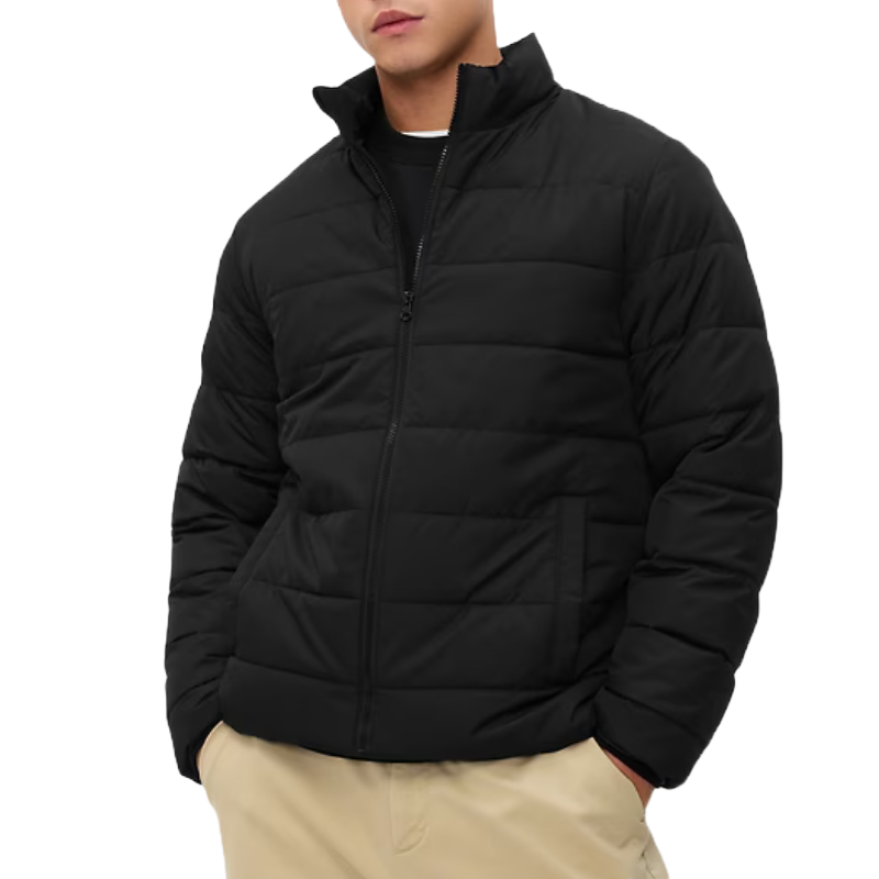 The ColdControl Puffer Jacket is a black, zip-up jacket with a quilted design for warmth and comfort. It features a high collar and side pockets, paired with a classic fit suitable for casual wear.