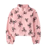 A pink fleece pullover with a half-zip front featuring a pattern of black bow designs, elastic cuffs, and a slightly cropped fit.