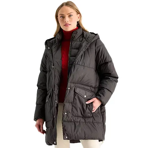 A woman is wearing a black puffer jacket with a hood over a red turtleneck sweater.