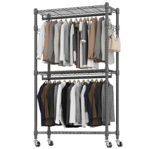 A metal clothing rack with two levels of hanging space for garments, featuring a top shelf for additional storage and locking caster wheels for mobility.