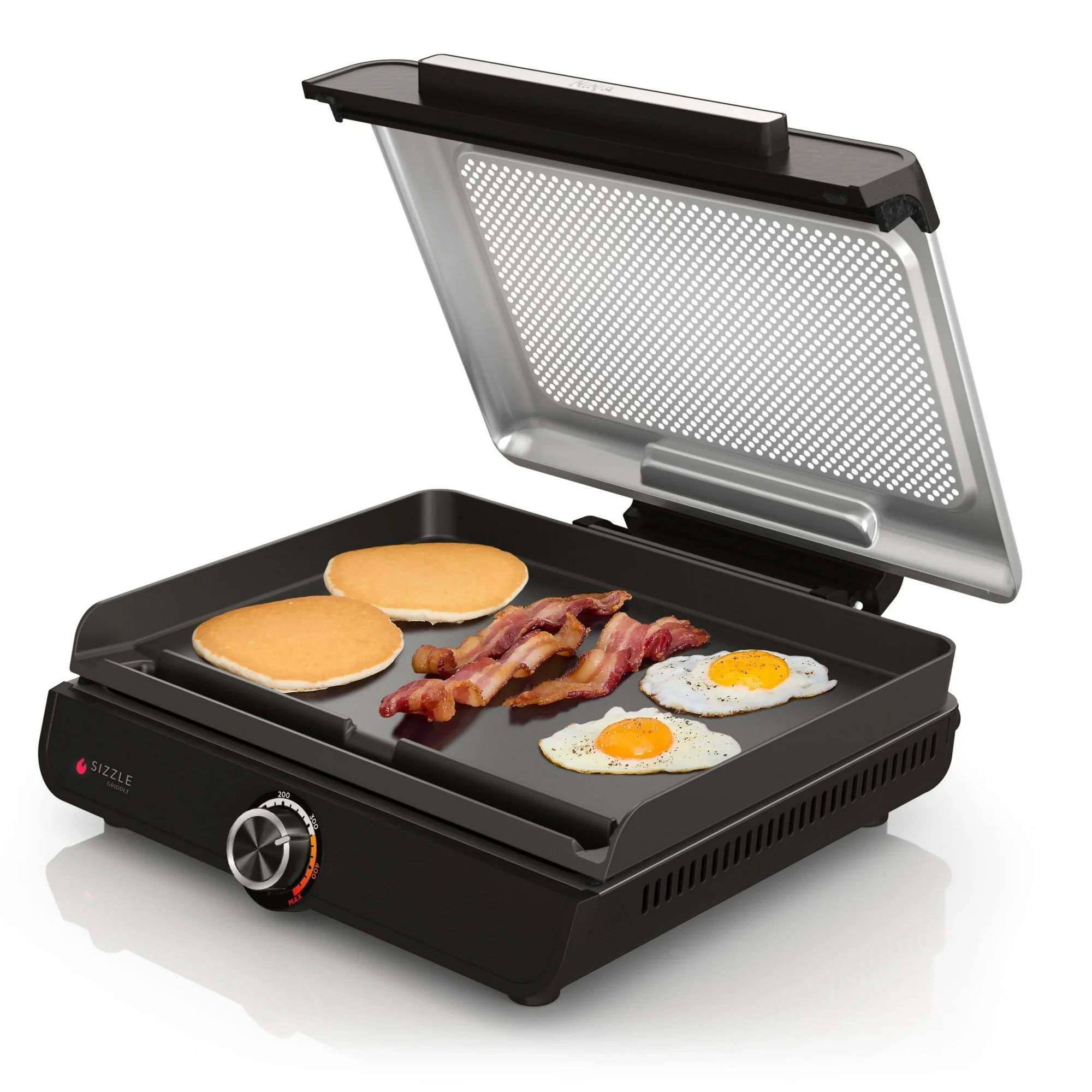 Ninja Sizzle Electric Griddle with a non-stick surface, adjustable temperature control, and a hinged lid cooking pancakes, bacon, and eggs.