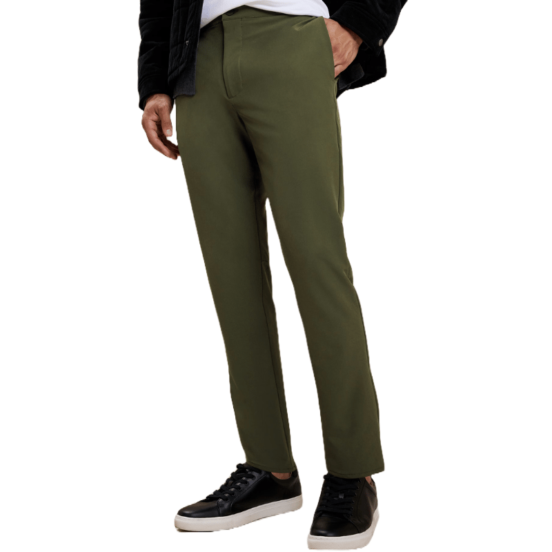 Banana Republic Factory Tapered Pant in olive green features a slim, tapered fit with a clean line. They're paired with black leather sneakers and a dark jacket.