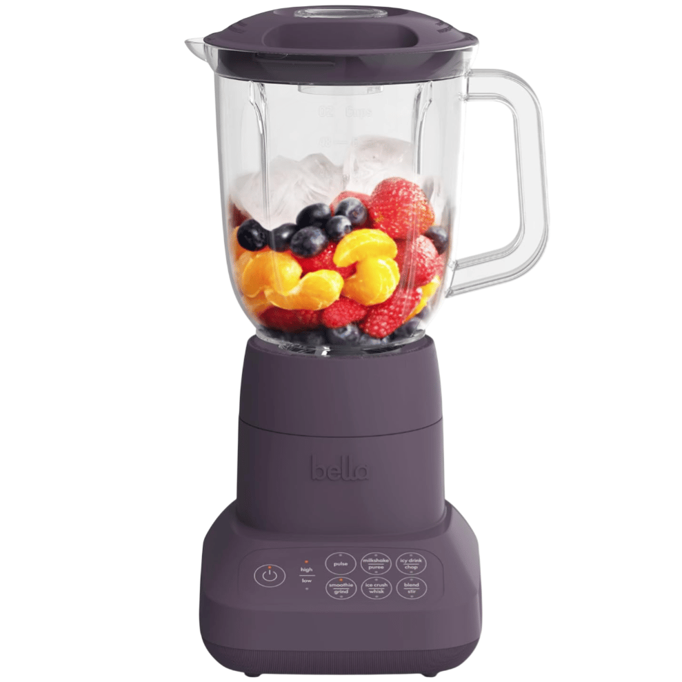 A dark purple Bella blender with a glass container, filled with mixed fruits and ice. The base features buttons labeled for various functions like pulse, milkshake, and smoothie.