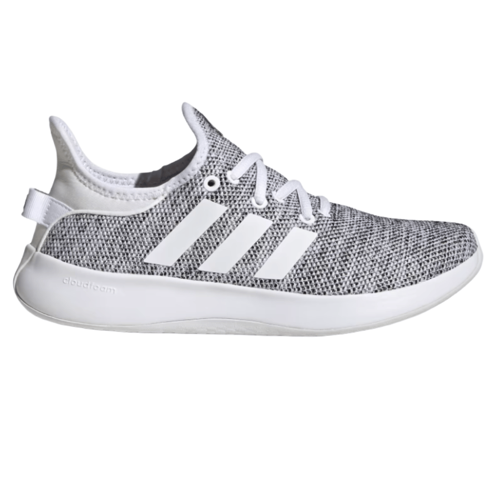 A gray and white sneaker with three white stripes on the side, featuring a textured knit upper and a white Cloudfoam sole.