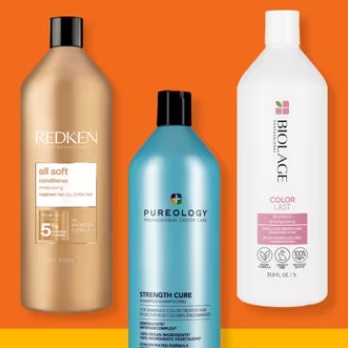 Three haircare bottles: Redken conditioner, Pureology Strength Cure, and Biolage Color Last Shampoo.