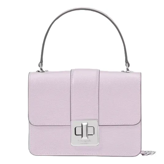 A lilac-colored handbag with a structured design, featuring a top handle and a rectangular silver turn-lock closure on the front flap.