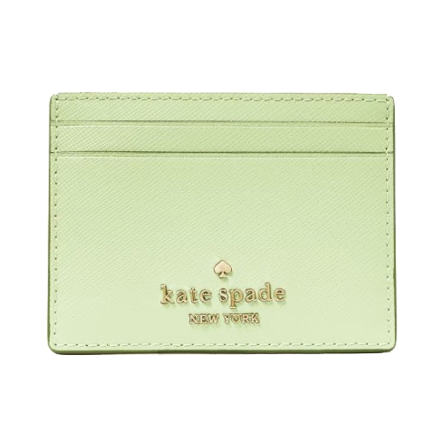 A light green Kate Spade cardholder featuring gold embossed branding and two card slots on the front.