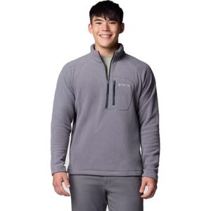 A man is wearing a grey Columbia fleece pullover with a quarter-zip and chest pocket.