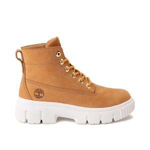 Tan ankle-height boots with a white chunky sole and the Timberland logo on the side.